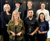 Donna Boyd, Agricultural Manufacturers of Canada president, back left, and Canada’s Outdoor Farm Show’s man in black, Rob O’Connor, show director, emceed the Innovation Program Awards on Sept. 8, 2025, the night before the Farm Show opened. Chuck Baresich, Haggarty AgRobotics founder, back centre, won in the Equipment category. Behnam Abbasian, BioFerScience, back right, won in the Livestock category. Kristine White, Spornado CEO and co-founder, front left, took home the Agronomics award. LaSalle Agri Inc., Marketing Coordinator Amin Phoenix, accepted the Environmental Sustainability award, and Bruna Mion, Lactanet dairy production expert, captured the Business Solutions award. Photo: Diana Martin
