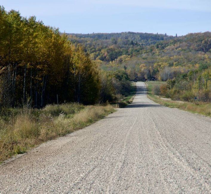 Turning trees greet fall visitors to the eastern gate of Riding Mountain National Park, one starting point into the eastern Escarpment Trail Network, which includes the Gorge Creek Trail and routes to Bald Hill. Photo: Alexis Stockford