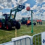 Competitors had to put a ball in a hoop using bale forks. Photo: Kristy Nudds