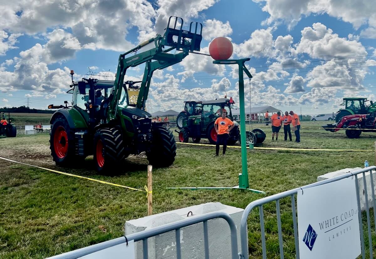 Competitors had to put a ball in a hoop using bale forks. Photo: Kristy Nudds
