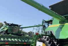 John Deere combines on display at Canada’s Outdoor Farm Show on Sept. 11. Photo: Greg Berg