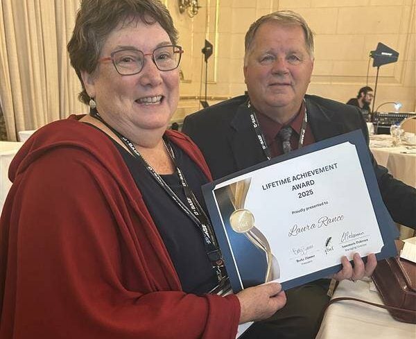 GFM executive editor Laura Rance (left) displays her Canadian Farm Writers Federation Lifetime Achievement Award. Photo: Gord Gilmour