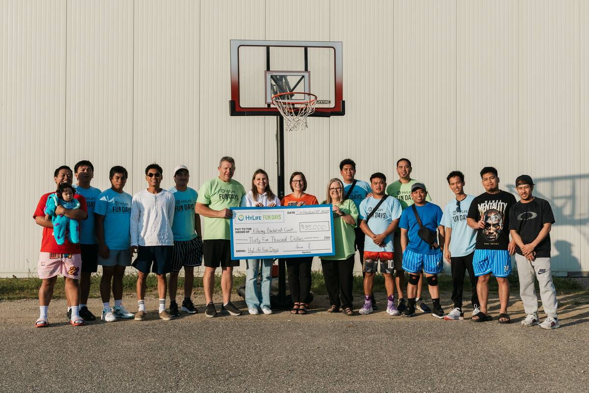 Members of the Killarney Basketball Court Enhancement Project accept a cheque for ,000 from HyLife for upgrades. Photo: Submitted