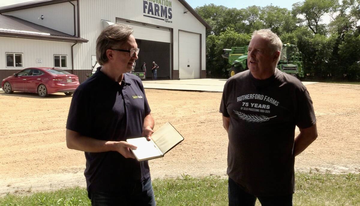 Rick Rutherford talks with digital editor Greg Berg at the 4R Field Day at Rutherford Farms on Aug. 6, 2025.