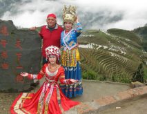 Philippe Sabourine poses with locals in front of rice terraces in China.