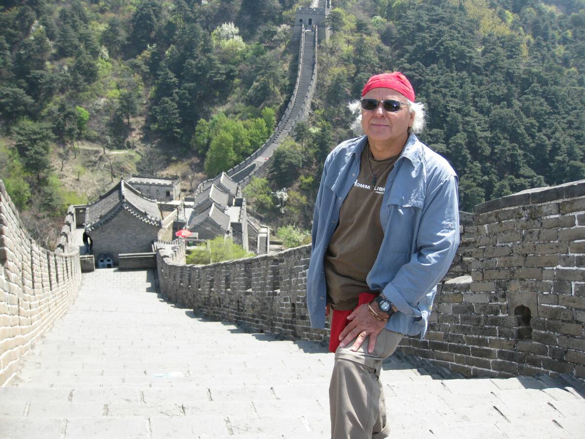 Philippe Sabourin standing on the Great Wall of China during one international trip. Photo: Submitted