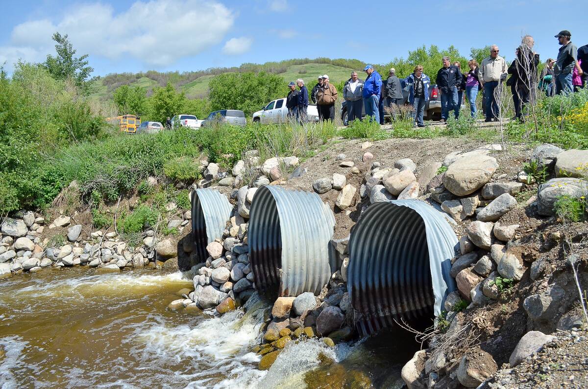 A 2017 tour, which highlighted an initial phase of the Manitoba Forage and Grassland Association's Aquanty project, stops at a water control structure in the Assiniboine-Birdstail watershed, one of the areas included in that first hydrological model. Photo: File