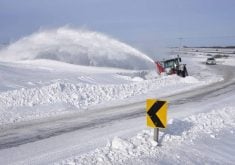 A tractor blowing snow in rural Saskatchewan. PHOTO: FILE