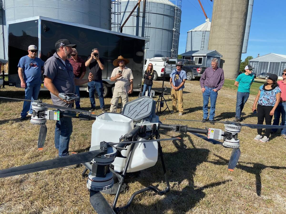 Adrian Rivard talks to attendees of a cover drop seeding demonstration near Embro. Photo: John Greig