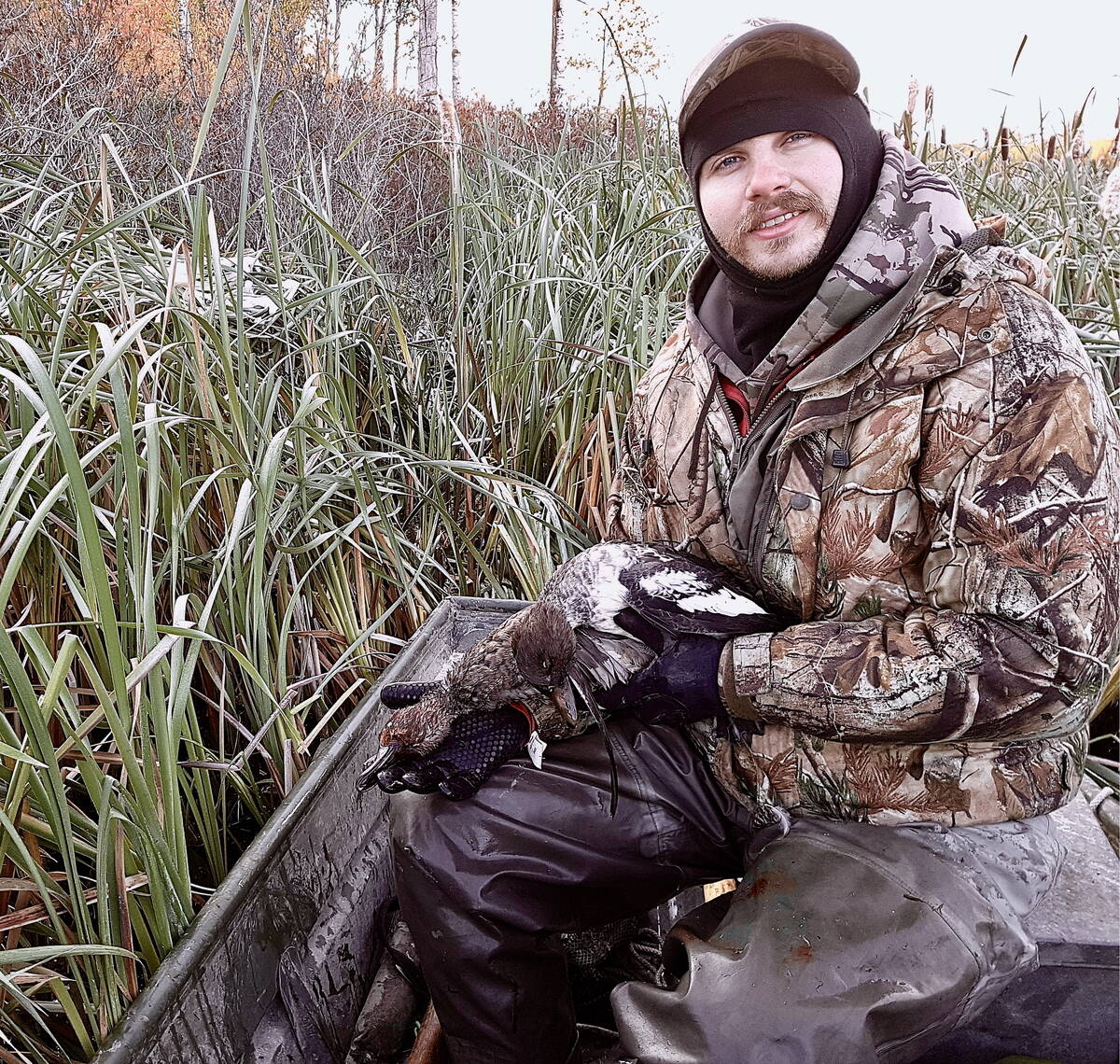 Mark Sopuck bundles up for a late-fall waterfowl hunt. Late-season marsh hunts require special attention to dressing properly. Photo: Tim Sopuck