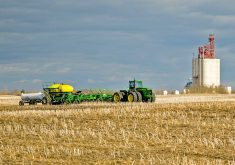 Seeding and spreading anhydrous fertilizer. PHOTO: FILE