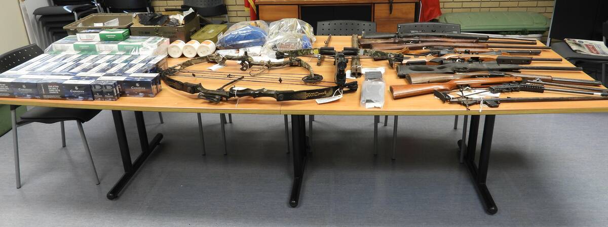 Firearms, ammunition and other items seized by police from a property in Zhoda, in Manitoba’s rural southeast, on Oct. 28, 2025. Photo: RCMP