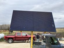 This solar panel recharges the four six-volt batteries on the SunStream Solar water trough on Scott Duguid's farm.  Photo: Greg Berg