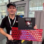 Padraic George shows the fence system he developed to keep rodents out of combines. Photo: John Greig