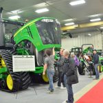 Manitoba Ag Days attendees take the chance to look under the hood at the equipment booths of major dealerships and machinery manufacturers during the 2018 show in Brandon. Photo: Alexis Stockford