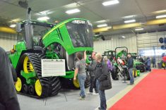 Manitoba Ag Days attendees take the chance to look under the hood at the equipment booths of major dealerships and machinery manufacturers during the 2018 show in Brandon. Photo: Alexis Stockford