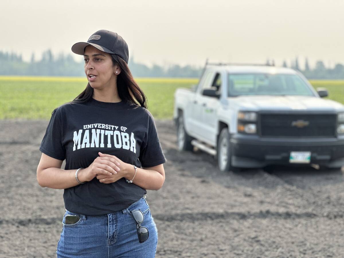University of Manitoba researcher Loveleen Kaur Dhillon at her corn weed-timing trial near Arborg, Man. where dry conditions provided a sharp contrast to her other Manitoba sites at Carman and Melita. Photo: Don Norman