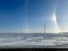 Windmills on a field during a cold winter day in central Manitoba. Photo: Alexis Stockford