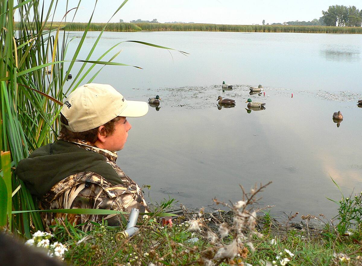 Young hunters quickly learn that most hunting time is spent watching and waiting for something to happen. Photo: Tim Sopuck