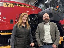 Farrah Wilson, of Versatile, and Manitoba Agricultural Museum volunteer Elliot Sims at Manitoba Ag Days 2026. Photo: Gord Gilmour