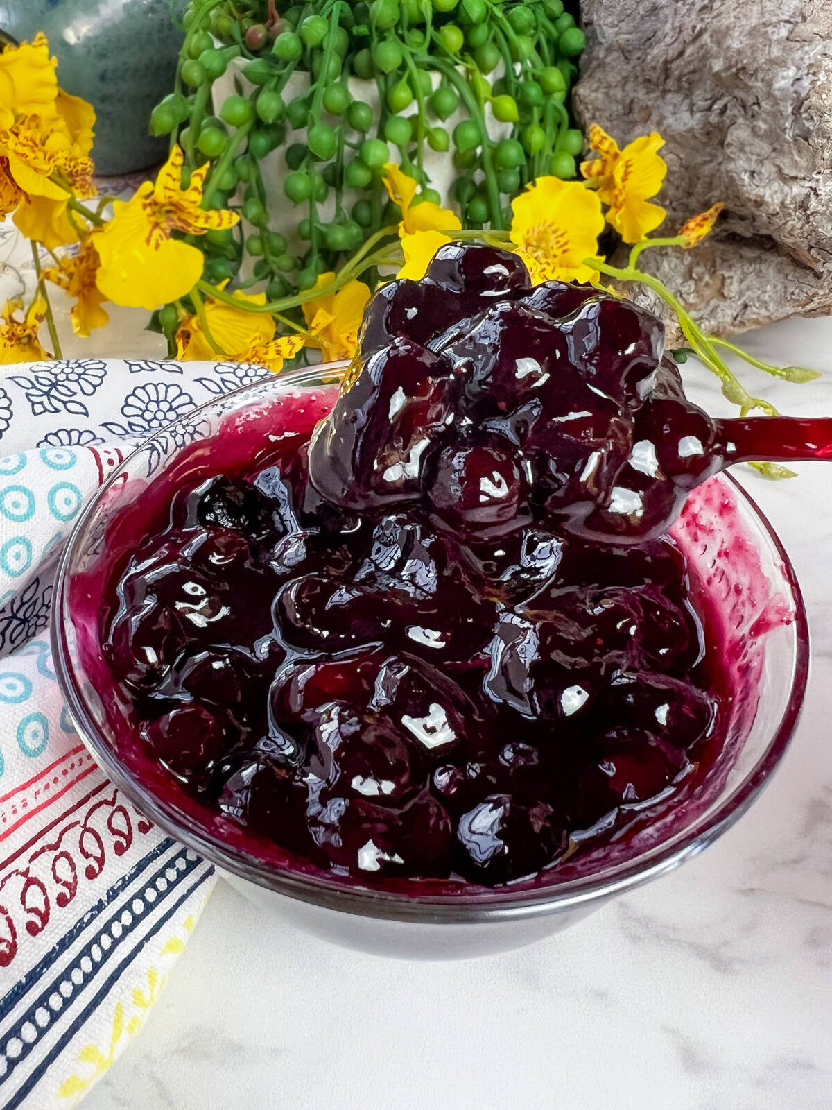 A quick and easy fruit sauce perfect for topping pancakes, yogurt or ice cream. This is a blueberry lime sauce.
Photo: Getty Stewart