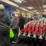 Farmers check out the latest planter offering from Pöttinger during Manitoba Ag Days 2026 in Brandon. Photo: Alexis Stockford