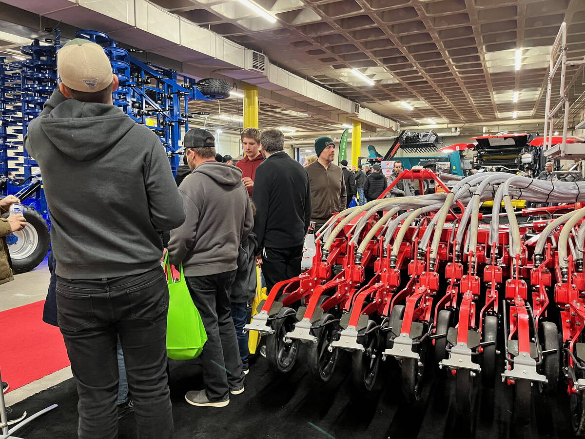 Farmers check out the latest planter offering from Pöttinger during Manitoba Ag Days 2026 in Brandon. Photo: Alexis Stockford