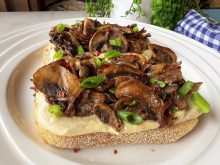 Leftover hummus and a handful of mushrooms make the most delicious toast. Photo: Getty Stewart