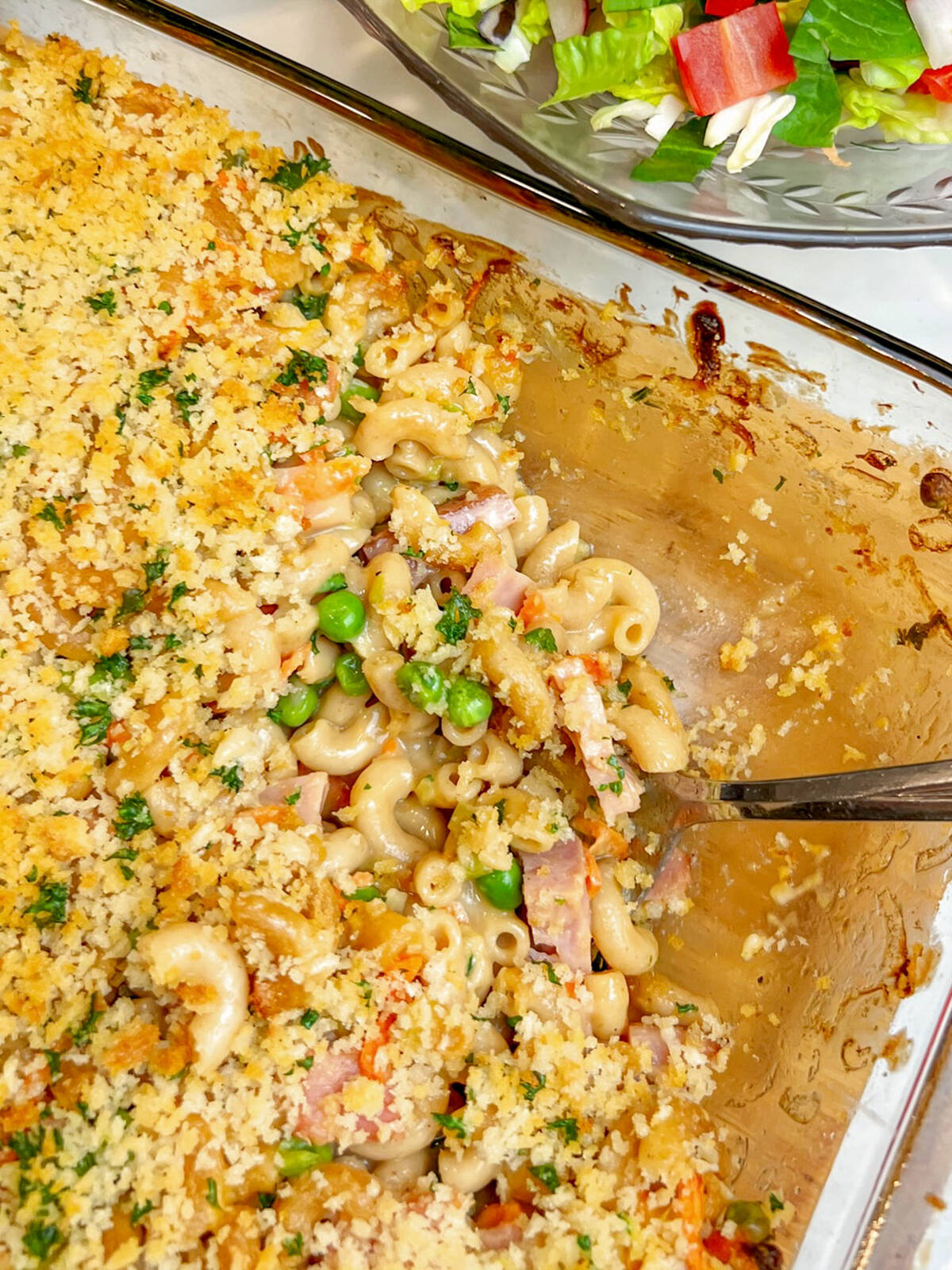 Crumbled crackers or breadcrumbs top a tasty mac and cheese made with leftover meat, cheese and veggies. Photo: Getty Stewart