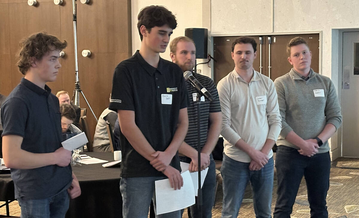 Students from the University of Manitoba’s Agriculture Diploma program address delegates while presenting a resolution on RTAC road expansion at the Keystone Agricultural Producers AGM in Winnipeg on Feb. 3. Photo: Don Norman
