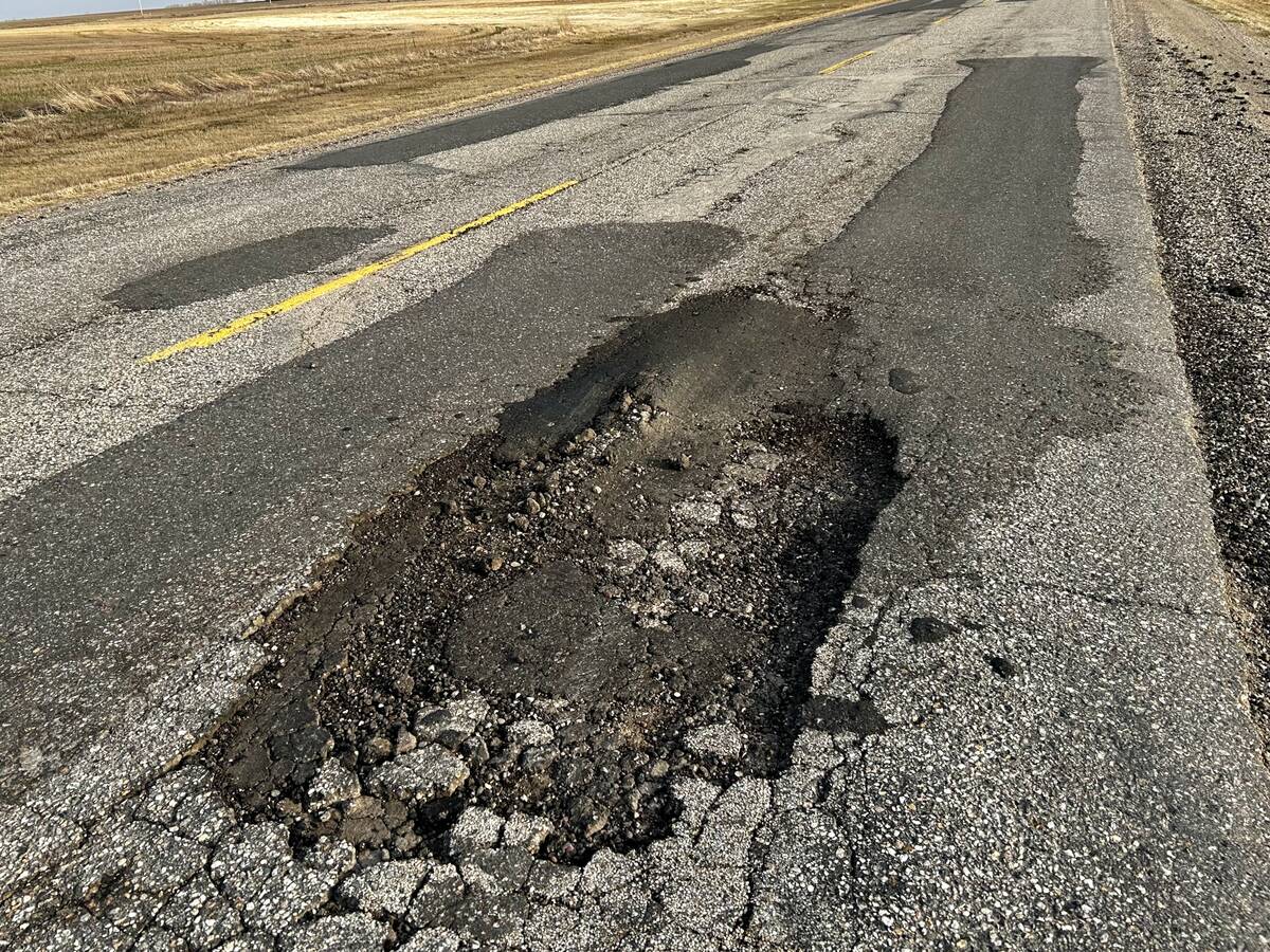 Manitoba’s pothole-ridden road conditions, and the lack of roads rated for heavier loads, have earned farmer ire. Photo: Alexis Stockford