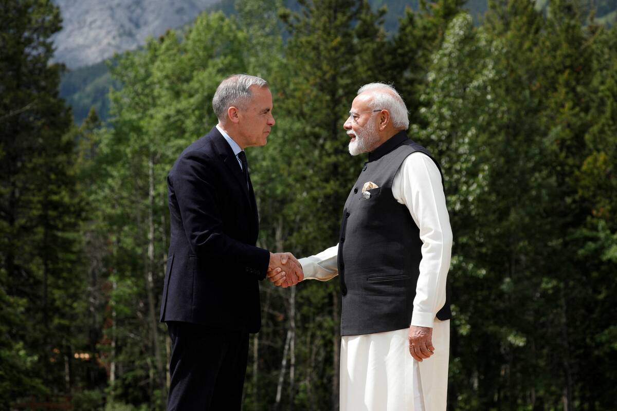 Canadian Prime Minister Mark Carney and India’s Prime Minister Narendra Modi shake hands before posing for a photo during the G7 Leaders’ Summit in Kananaskis, in Alberta, Canada, June 17, 2025. Photo: REUTERS/Amber Bracken
