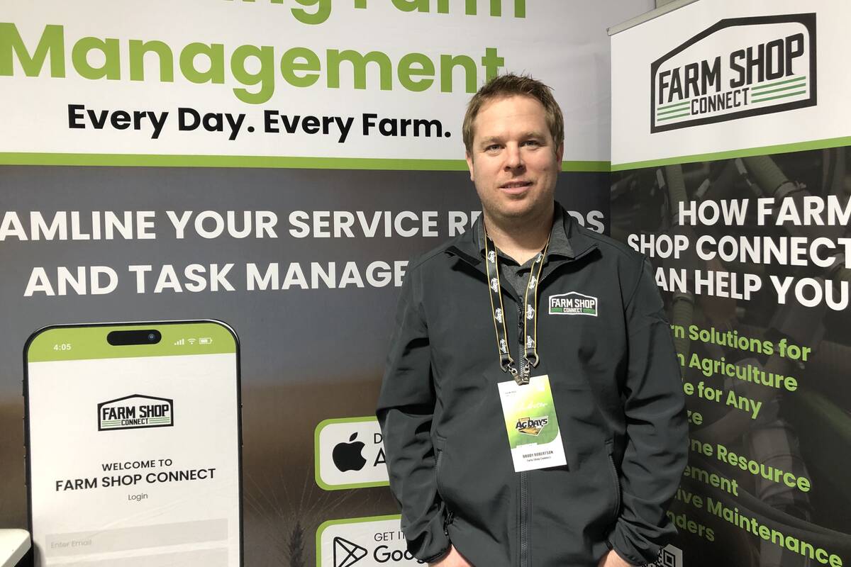 Brody Robertson standing at Farm Shop Connect exhibit booth during Manitoba Ag Days trade show in Brandon in January. Photo: Greg Berg