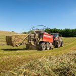 Red Hesston by Massey Ferguson large square baler with ejected bale in farm field. Photo: Agco