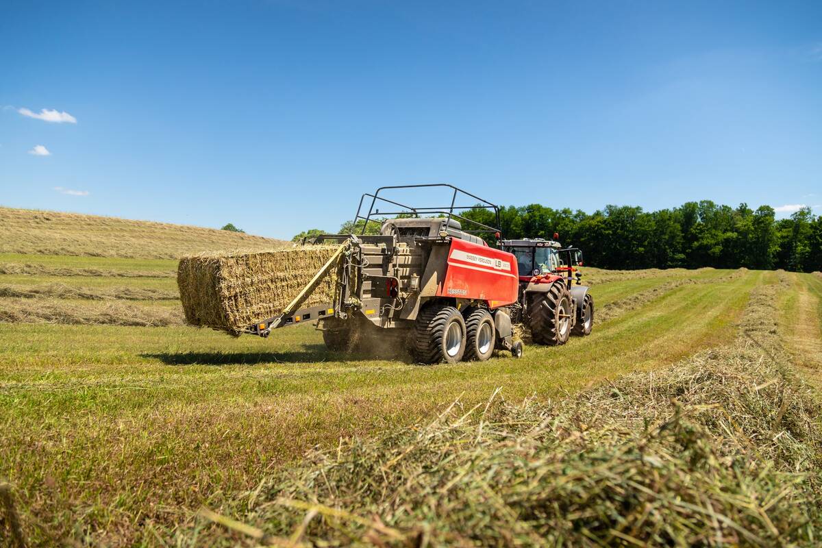 Red Hesston by Massey Ferguson large square baler with ejected bale in farm field. Photo: Agco