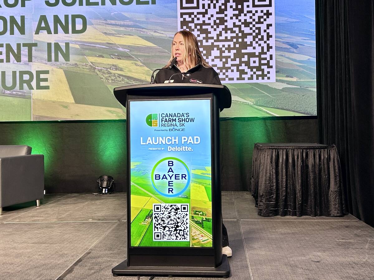 Jimmi-Lee Jackson from Bayer explains the make-up of its new products and their benefits during Canada’s Farm Show 2026. Photo: Janelle Rudolph