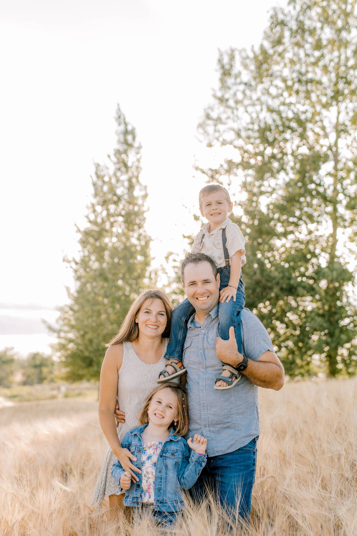 Braden and Misty Drul with their children Adilynn and Clayton on their farm near Oakburn. The young family is working to build a sixth-generation operation focused on long-term sustainability. Photo: supplied