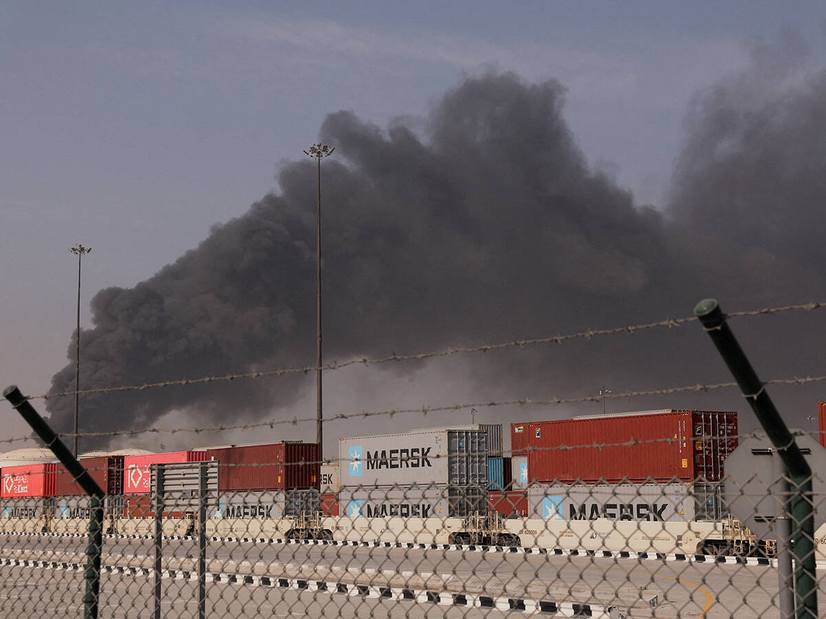 Black smoke rises above shipping containers at Jebel Ali port in the UAE after an Iranian attack that disrupted Middle East trade routes. Photo: Amr Alfiky/Reuters.