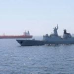 A Pakistan Navy ship escorts a Pakistani merchant vessel, as part of a maritime security operation, named Muhafiz-ul-Bahr, as regional tensions threaten key sea routes, amid the U.S.-Israeli conflict with Iran, at an unidentified location, released March 9, 2026, in this screen grab taken from a handout video. Photo: ISPR/Handout via REUTERS
