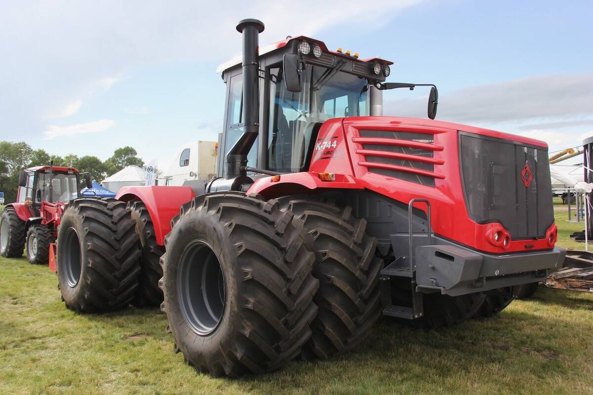 Red MTZ Kirovets K-744 four-wheel drive tractor on display at an outdoor farm show, a low-cost high-horsepower option built in Russia. Photo: Scott Garvey