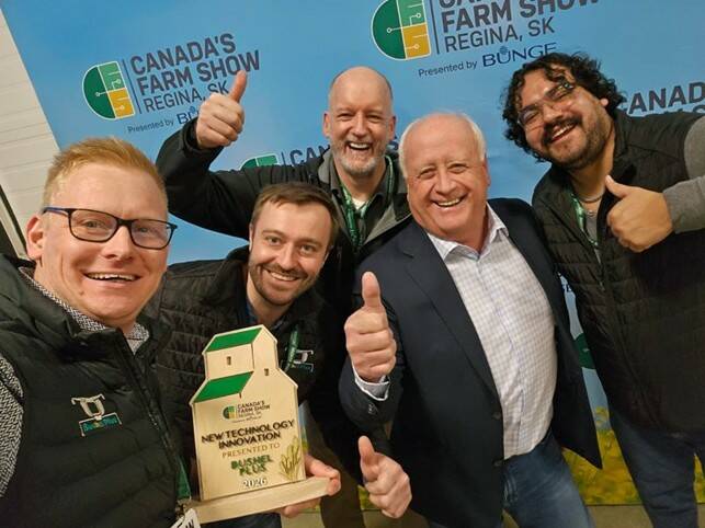 The Bushel Plus team celebrates with the New Technology Innovation award trophy at Canada's Farm Show in Regina on March 19, 2026. Photo: Bushel Plus
