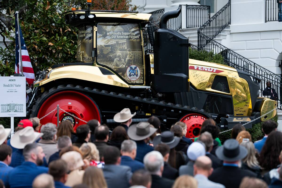 A golden farming tractor featuring the signatures of Trump Administration cabinet members is displayed during an event celebrating farmers and Agriculture Day on the South Lawn of the White House in Washington DC on Friday, March 27, 2026. Photo: Aaron Schwartz/Sipa USA
