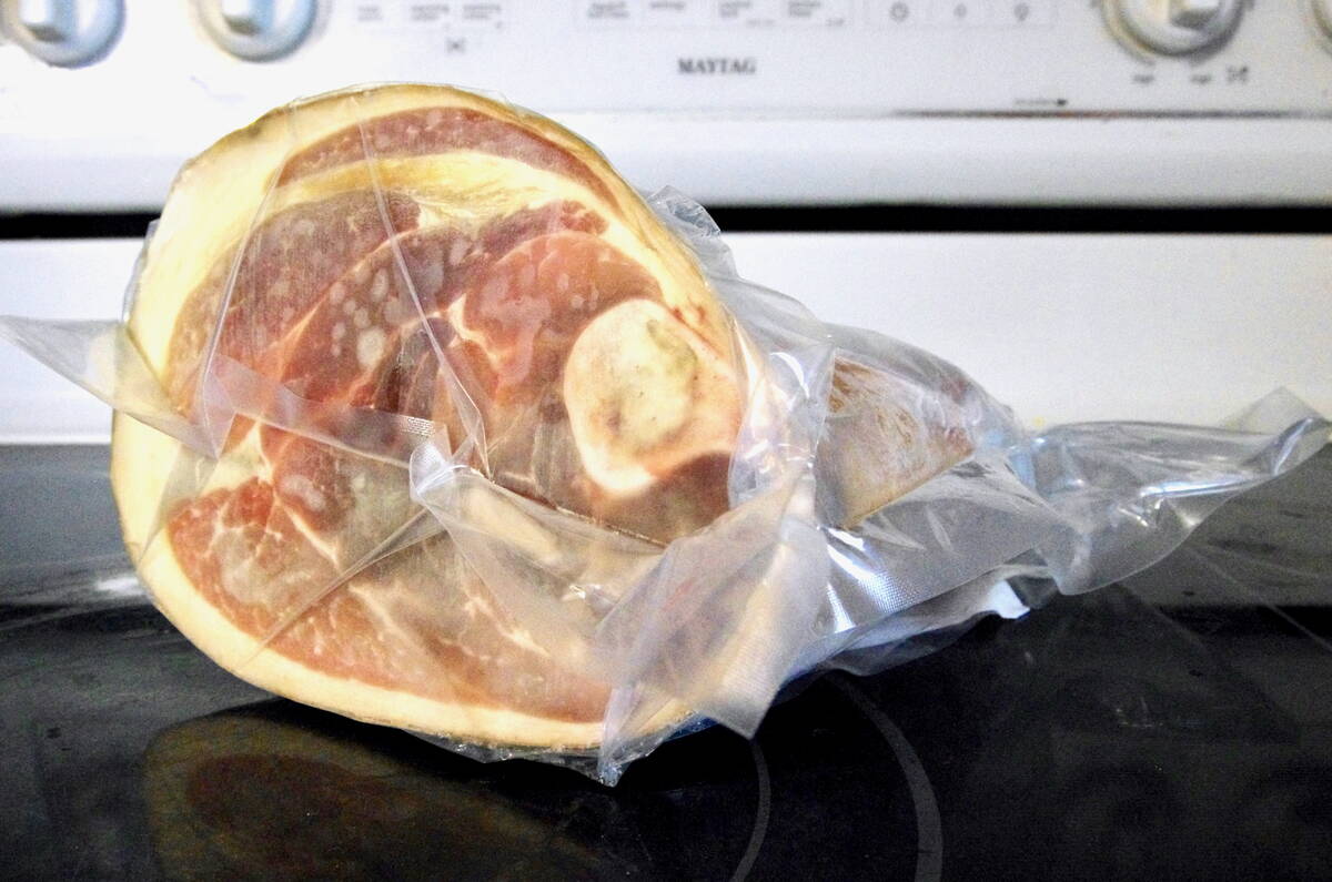 A cured ham in packaging on a kitchen counter. Meat processors say their main labour need is a better pipeline to permanent residency rather than expanded temporary foreign worker caps. Photo: Alexis Stockford.