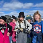 Participants of winter fishing event, put on by SVSFE, show off their catch.