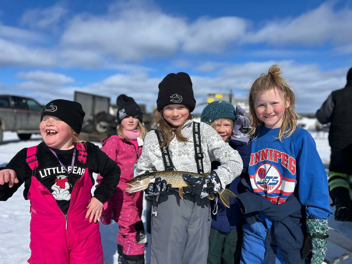 Participants of winter fishing event, put on by SVSFE, show off their catch.