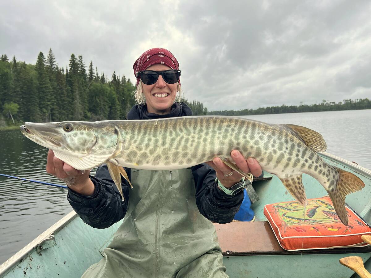 Holly Urban, SVSFE technician, with a Duck Mountains muskie. 