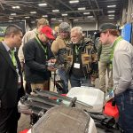 Attendees examine an advanced agricultural drone at the first Canadian Agricultural Drone Association conference in Camrose, Alta., as drone technology draws interest from young farmers. Photo: Mary MacArthur