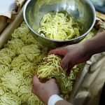 Ramen shop Menya Taisei's owner Taisei Hikage prepares to cook ramen with noodles at his shop in Tokyo, Japan, October 22, 2024. REUTERS/Kim Kyung-Hoon