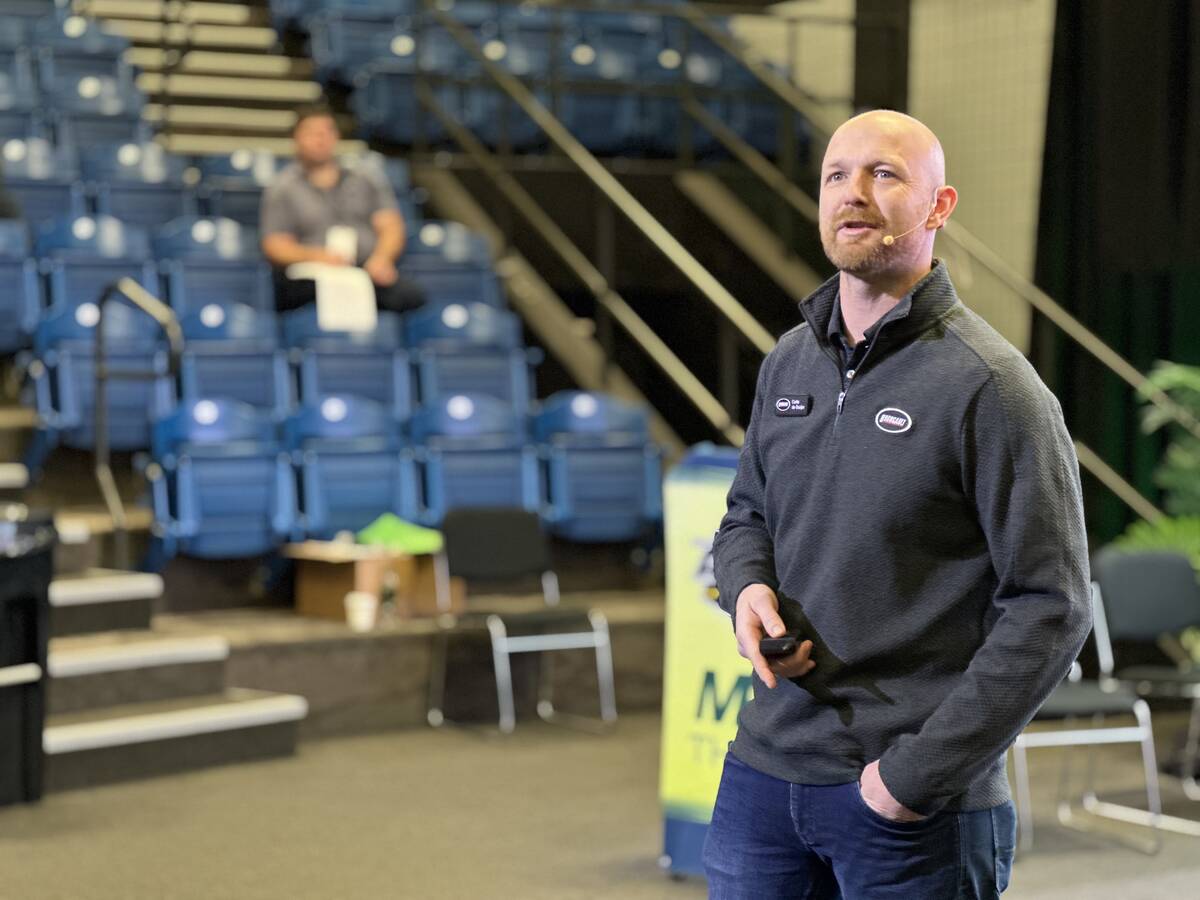 Curtis De Gooijer, in-house agronomist with Bourgault, presents canola seeding rate trial results at Manitoba Ag Days in Brandon. Photo: Don Norman